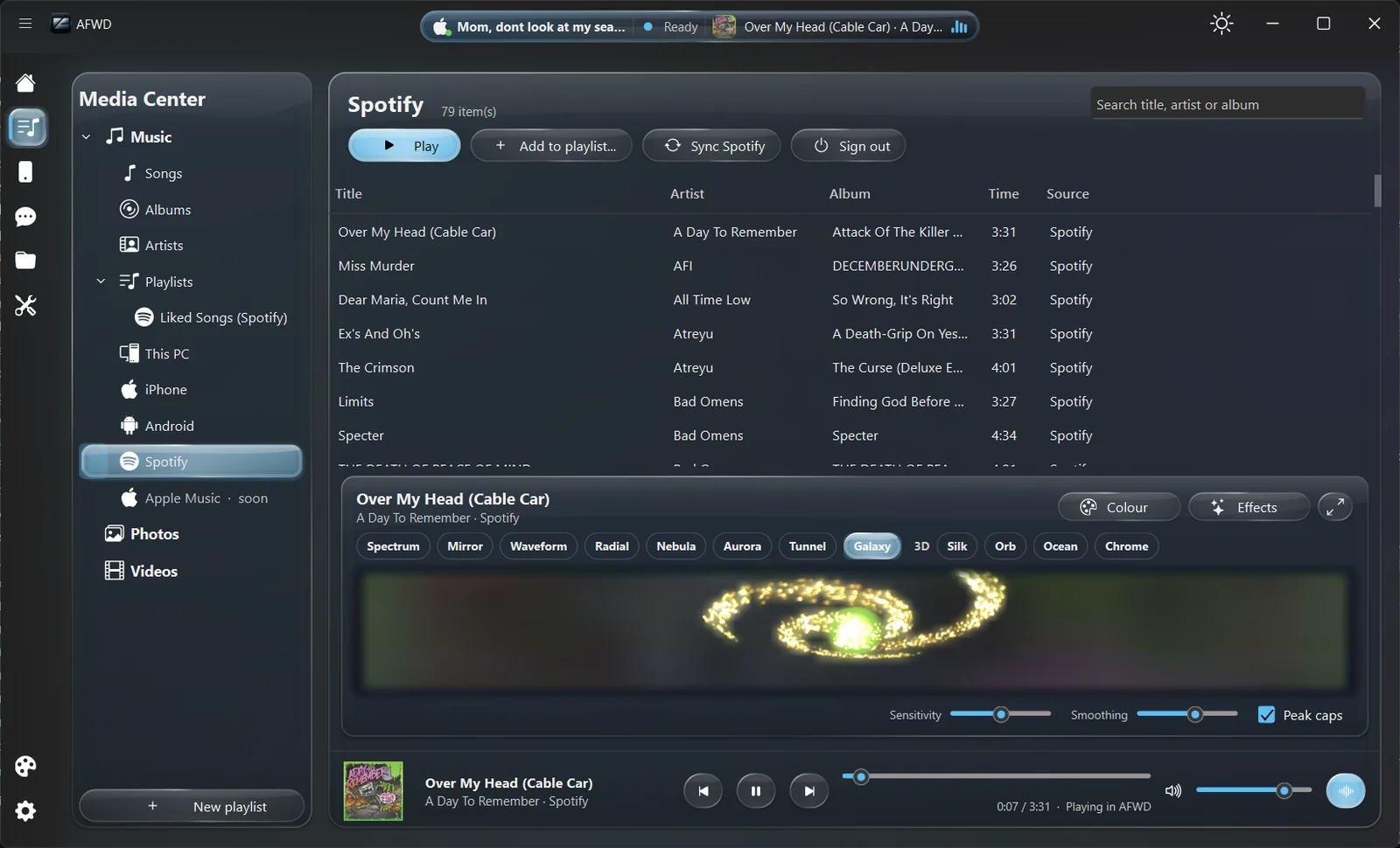 AFWD Media Center playing a Spotify track with the Galaxy music visualizer and a player bar